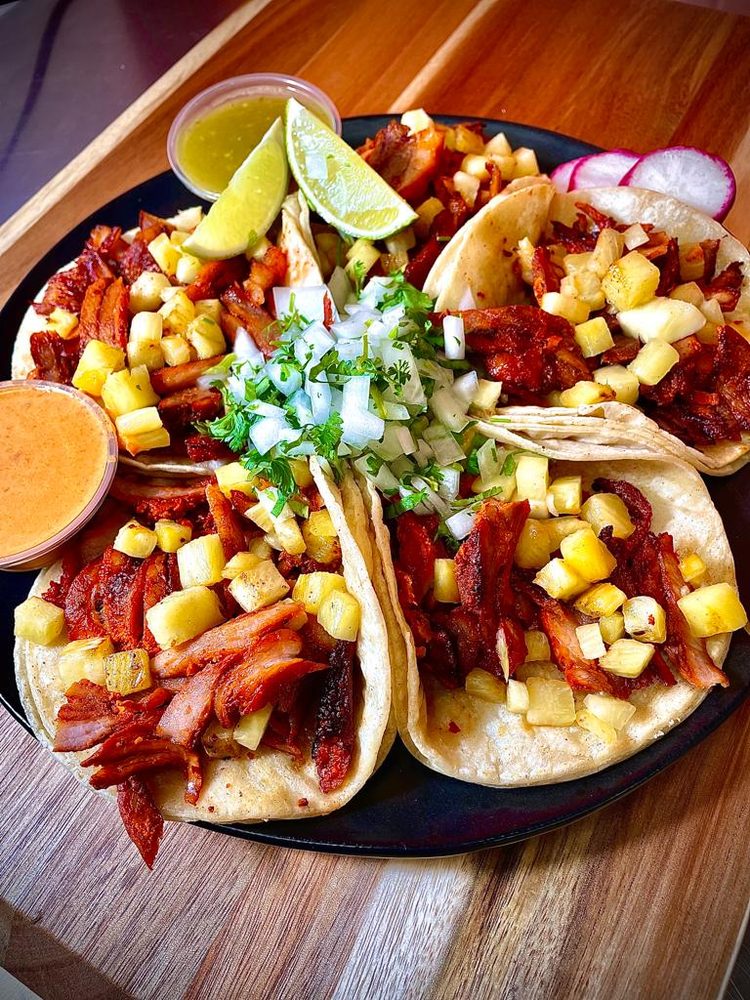 Plate of al pastor tacos